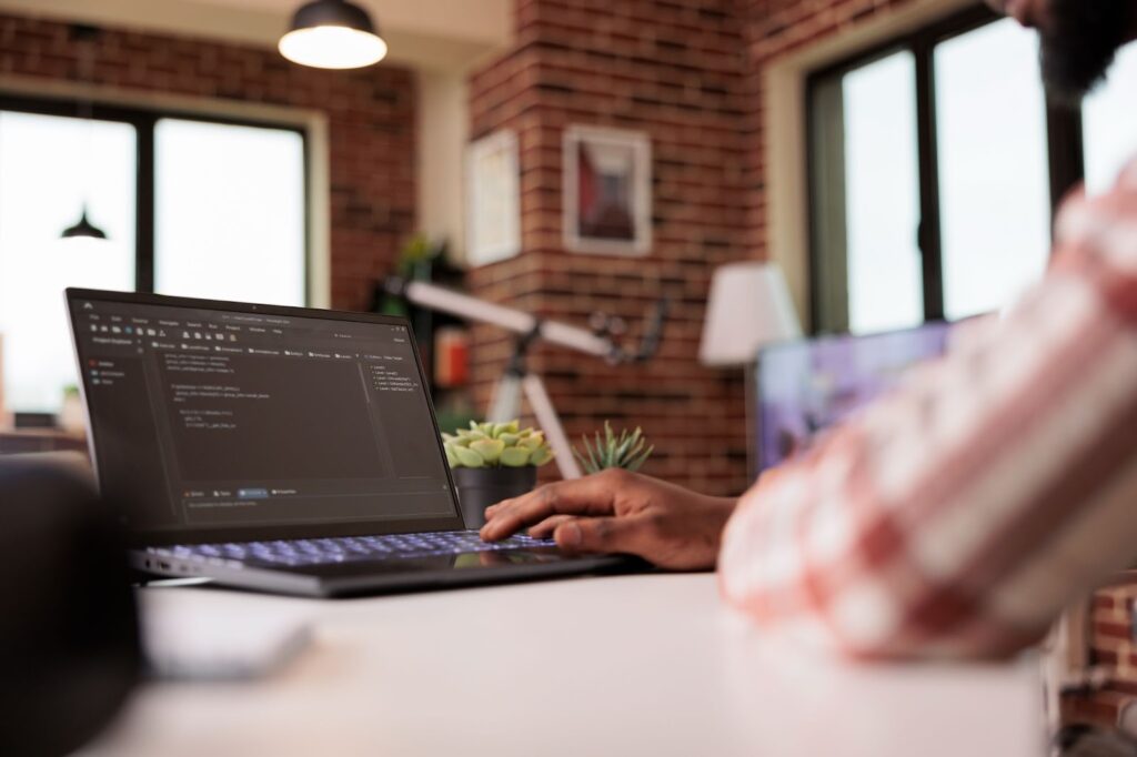 Man working with code on his computer
