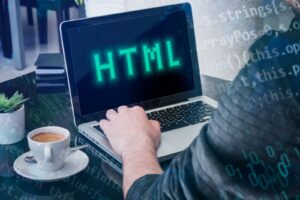 Person in front of computer working with html